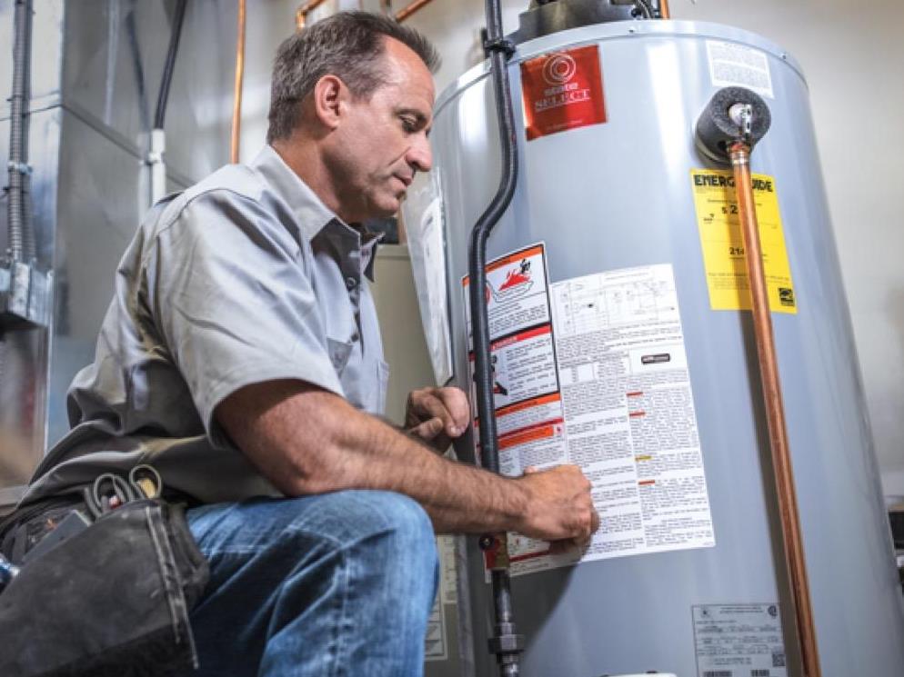 Superior Propane employee servicing a water heater. 