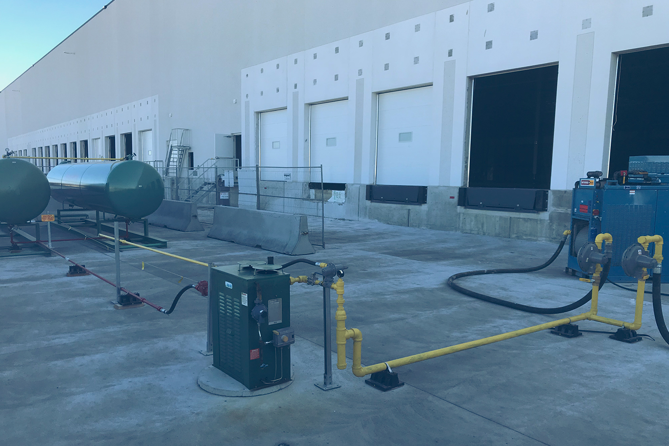 A temporary installation of propane tanks and related equipment at a commercial loading dock
