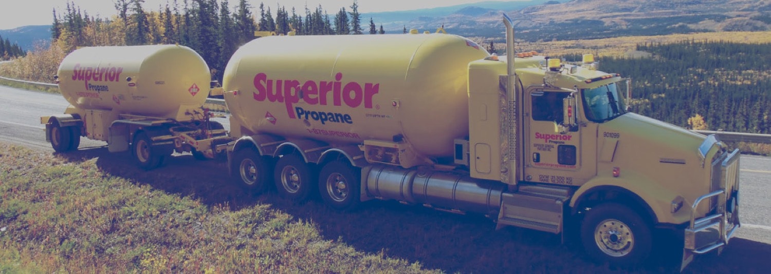 Superior Propane Truck on the highway, making a delivery in a mountainous area. 
