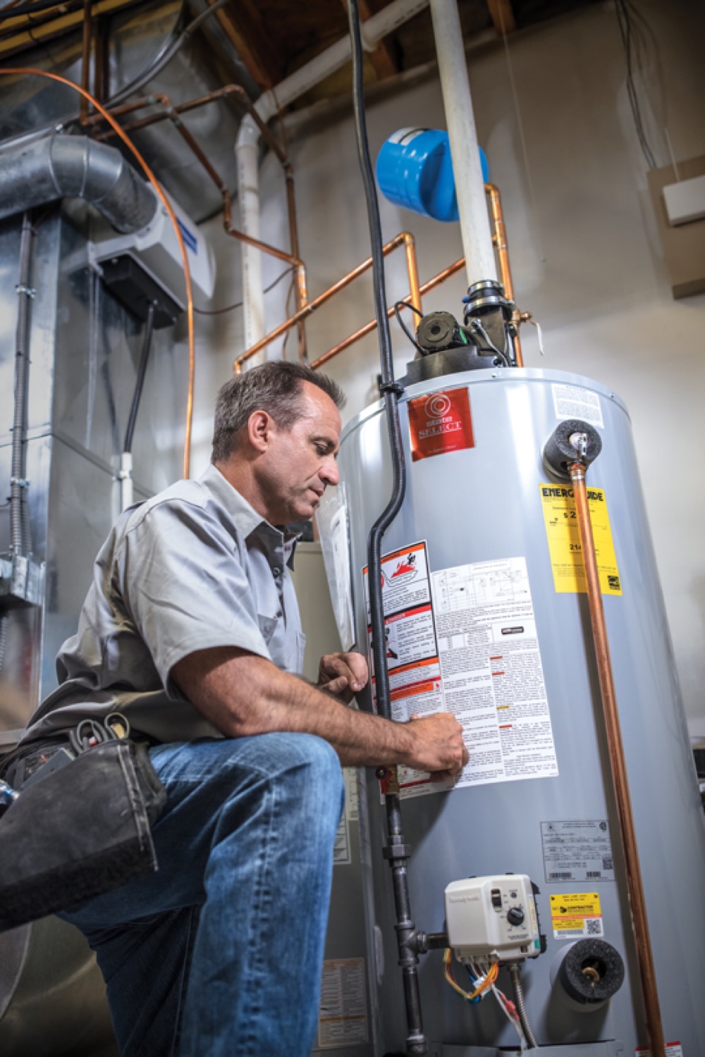 Superior Propane employee servicing a water heater.